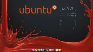 Escritorio de Ubuntu personalizado con fondo oscuro y detalles rojos, mostrando el logo de Ubuntu, widgets de sistema y barra de aplicaciones estilo dock.